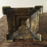 Old brass candle holder with square base