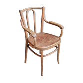 Curved wooden armchair