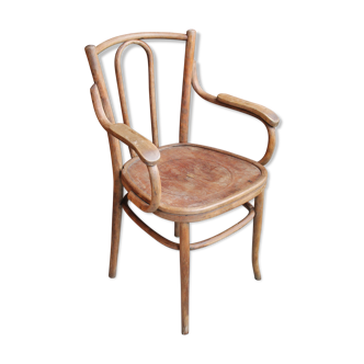 Curved wooden armchair