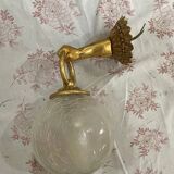 Vintage wall light in gilded bronze with a cracked glass globe.