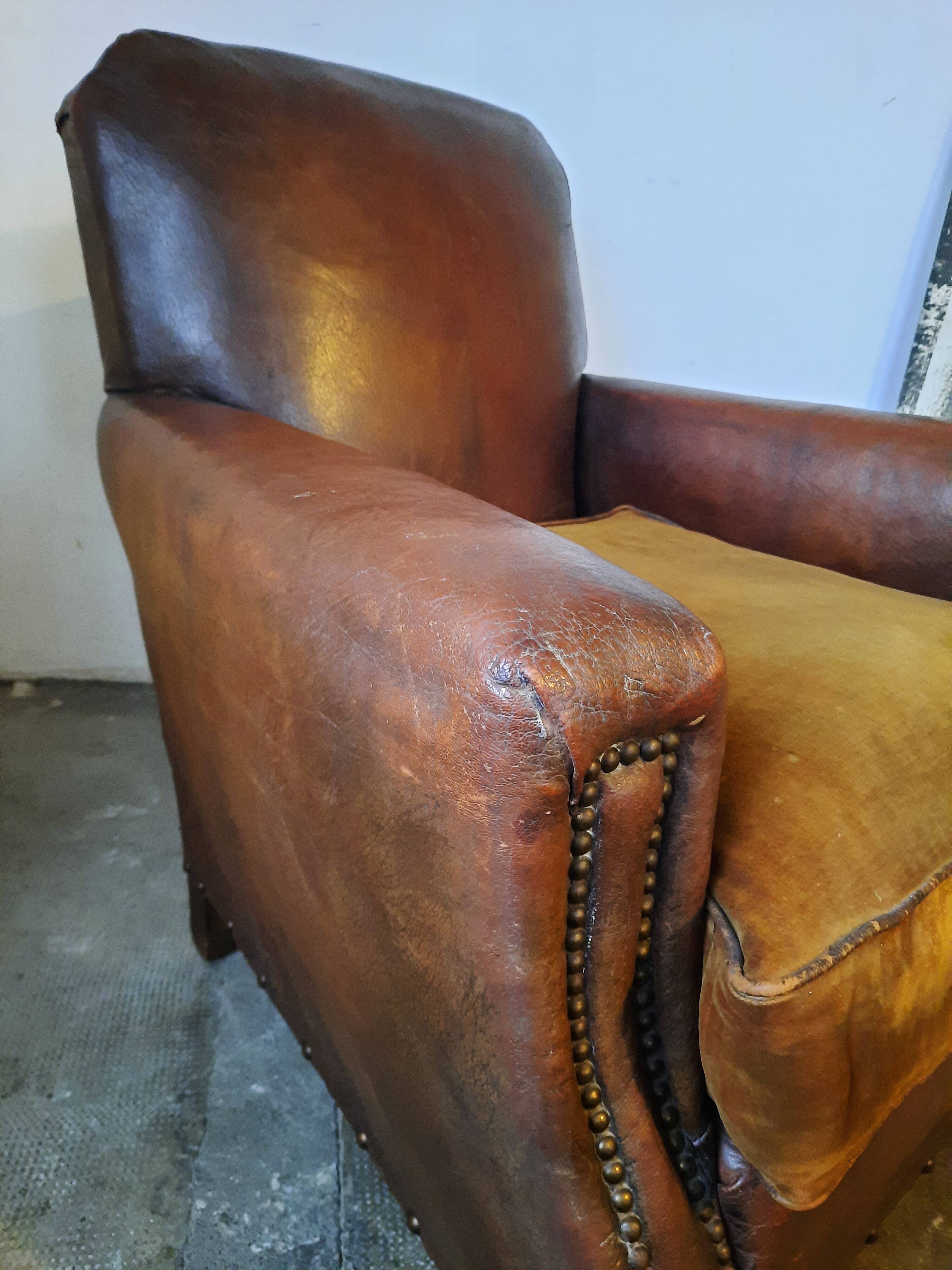 Old studded leather club chair 1930-1930