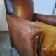 Old studded leather club chair 1930-1930