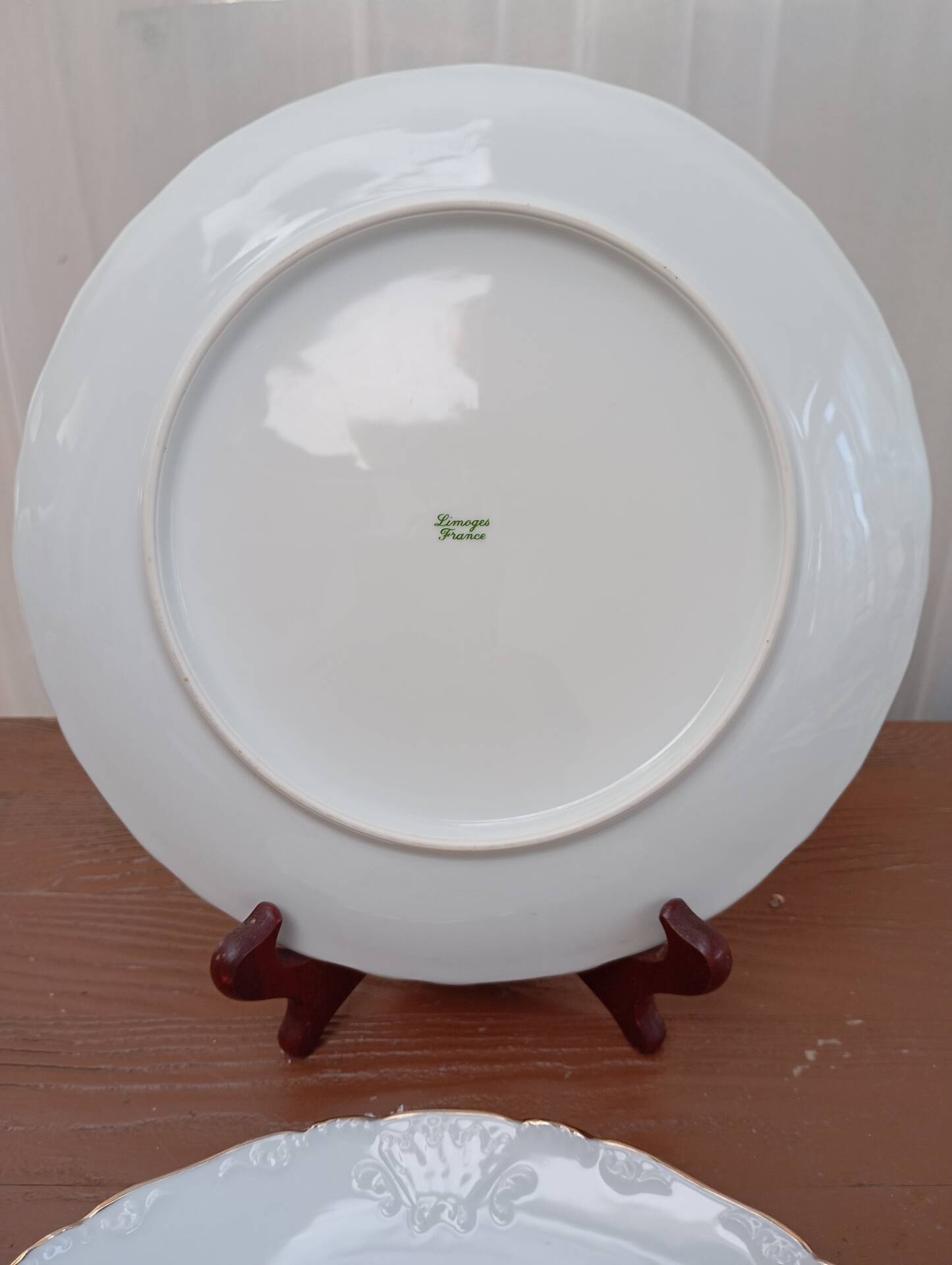 Two Limoges porcelain plates signed M. Hague.