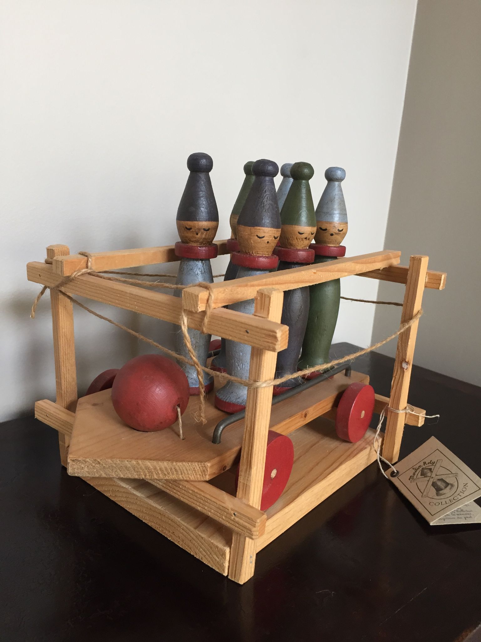 Set of Moulin Roty brand wooden bowling on roller cart, limited series.