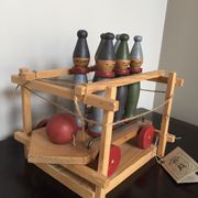 Set of Moulin Roty brand wooden bowling on roller cart, limited series.