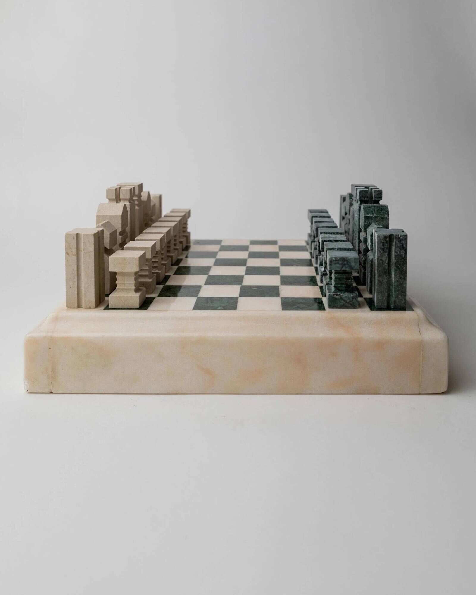Vintage marble chess set from the 1970s, green and beige stone board, heavy design, geometric pieces, sculptural tabletop game, gift idea.
