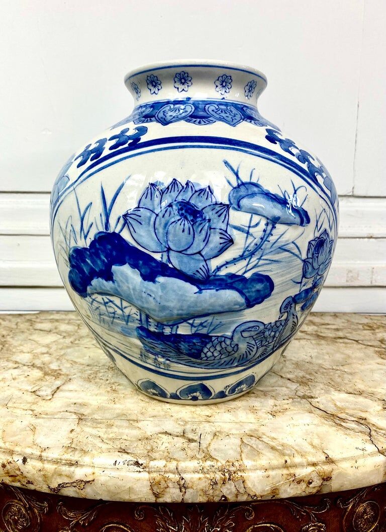 Chinese vase in blue-white porcelain decorated with lotus flowers