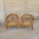 Two large rattan armchairs