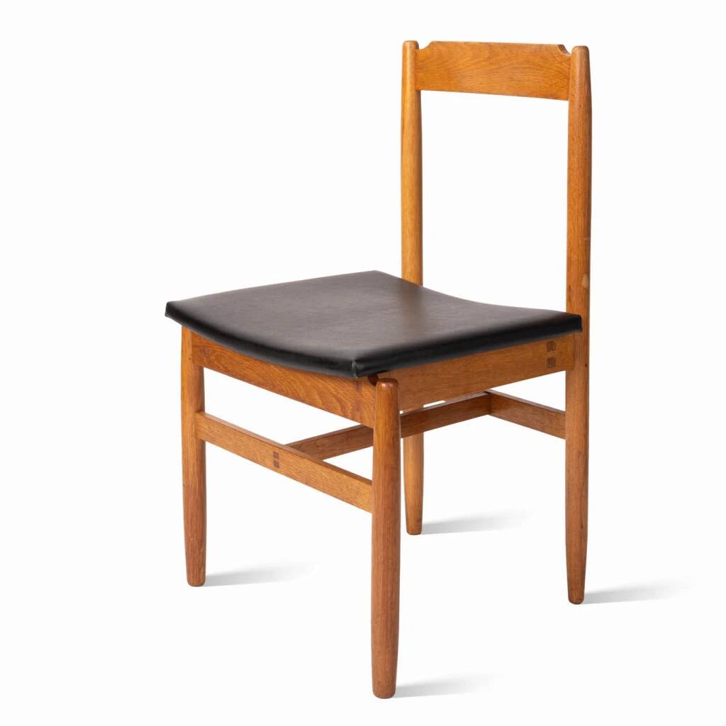 Oak chair with a black leather seat made in the 1960s