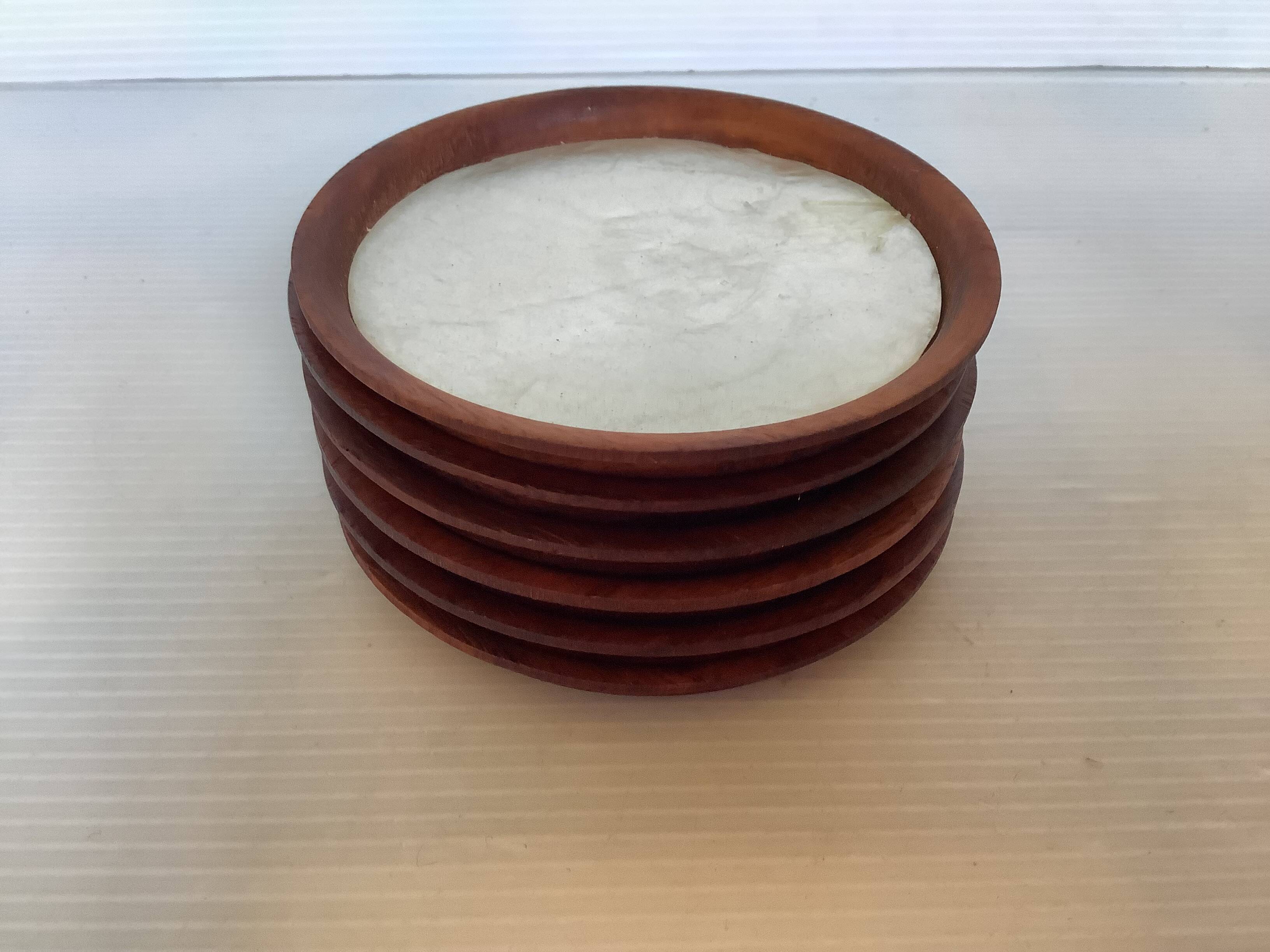 Six mother-of-pearl teak wood coasters