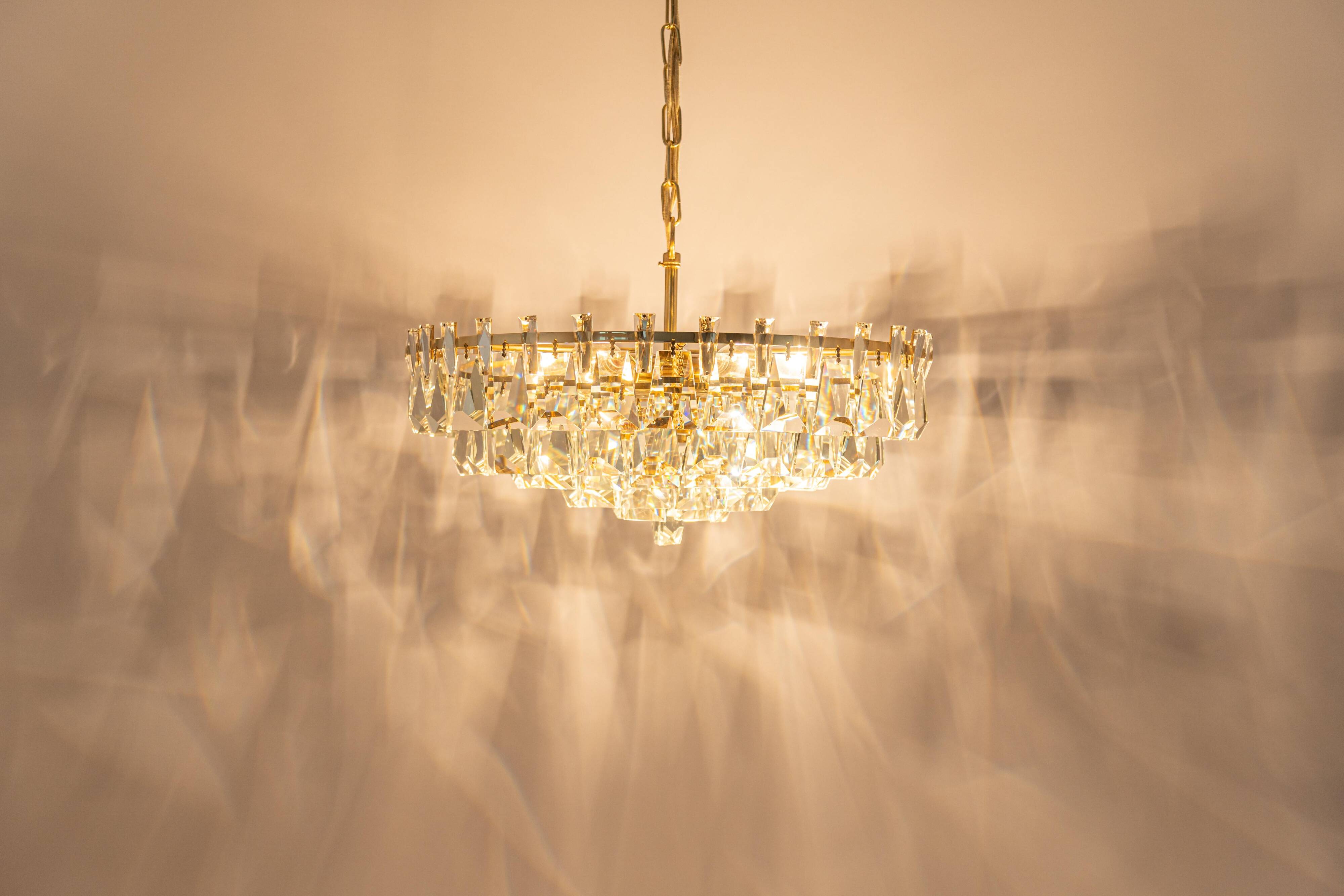 Large chandelier in gilded brass and crystal, by Palwa, Germany, 1970s.