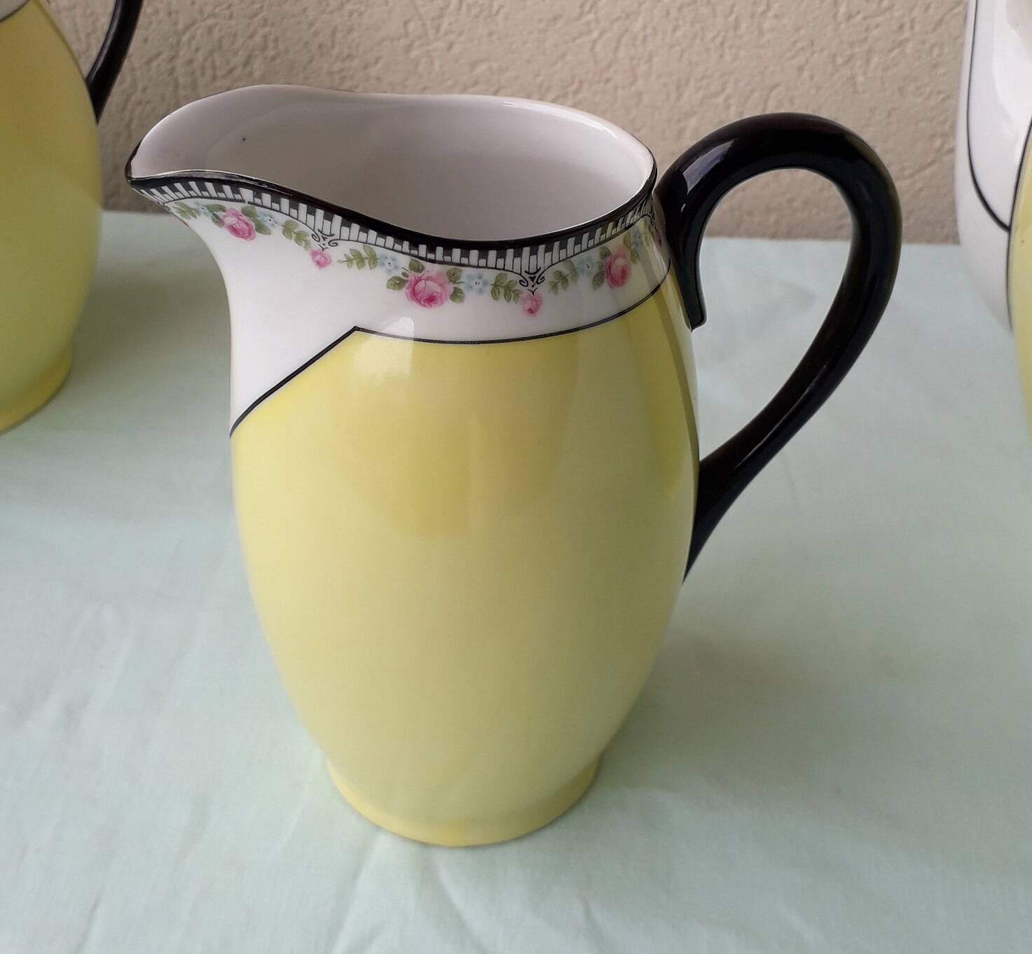 Coffee pot or teapot, sugar bowl and milk jug in porcelain.