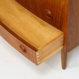 Commode à façade bombée Kai Kristiansen (Danemark, années 1960).