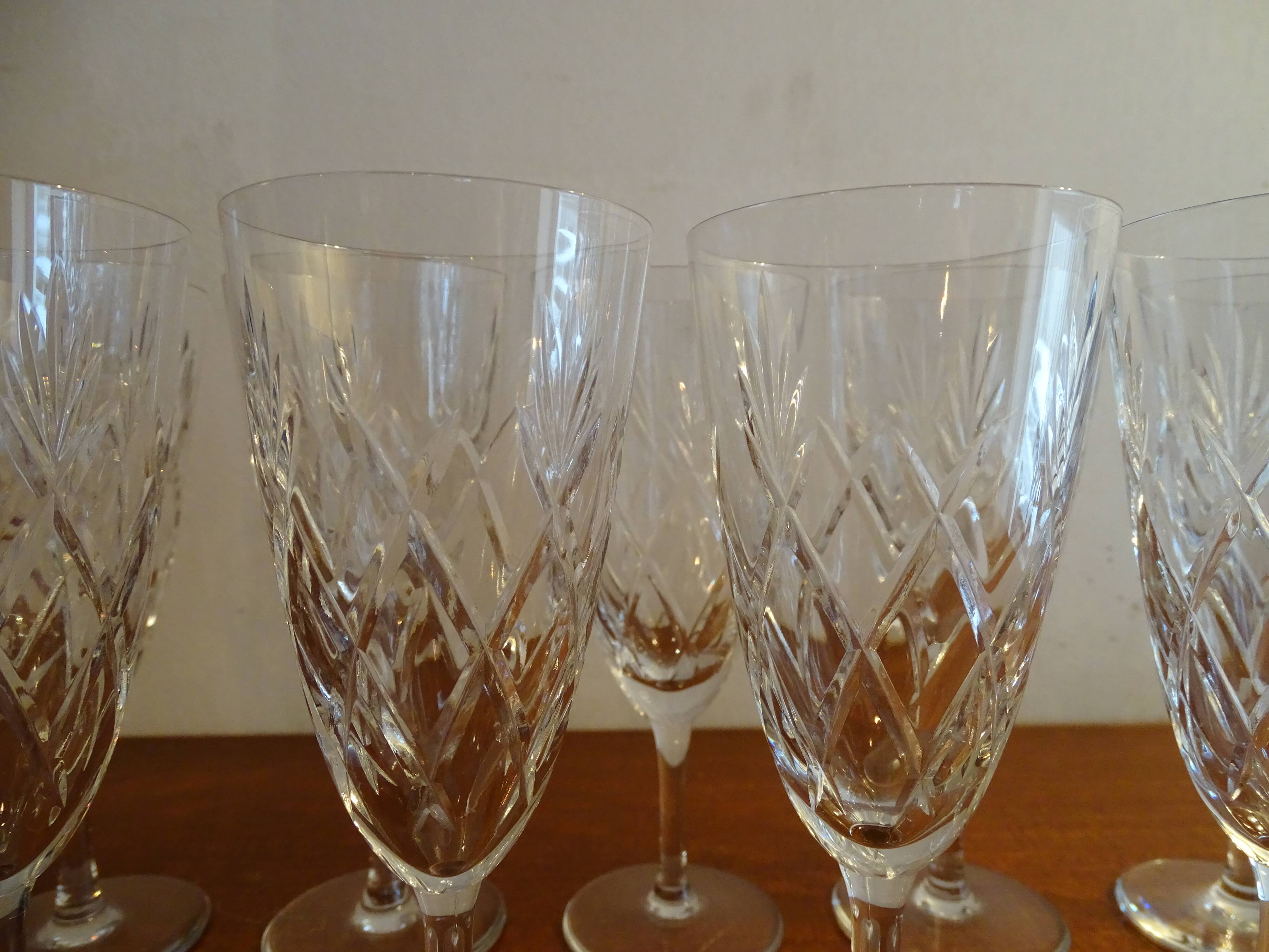 9 Bayel crystal champagne flutes signed, cut crystal.