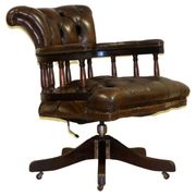 Restored Chesterfield captain's armchair in leather with an oak frame.