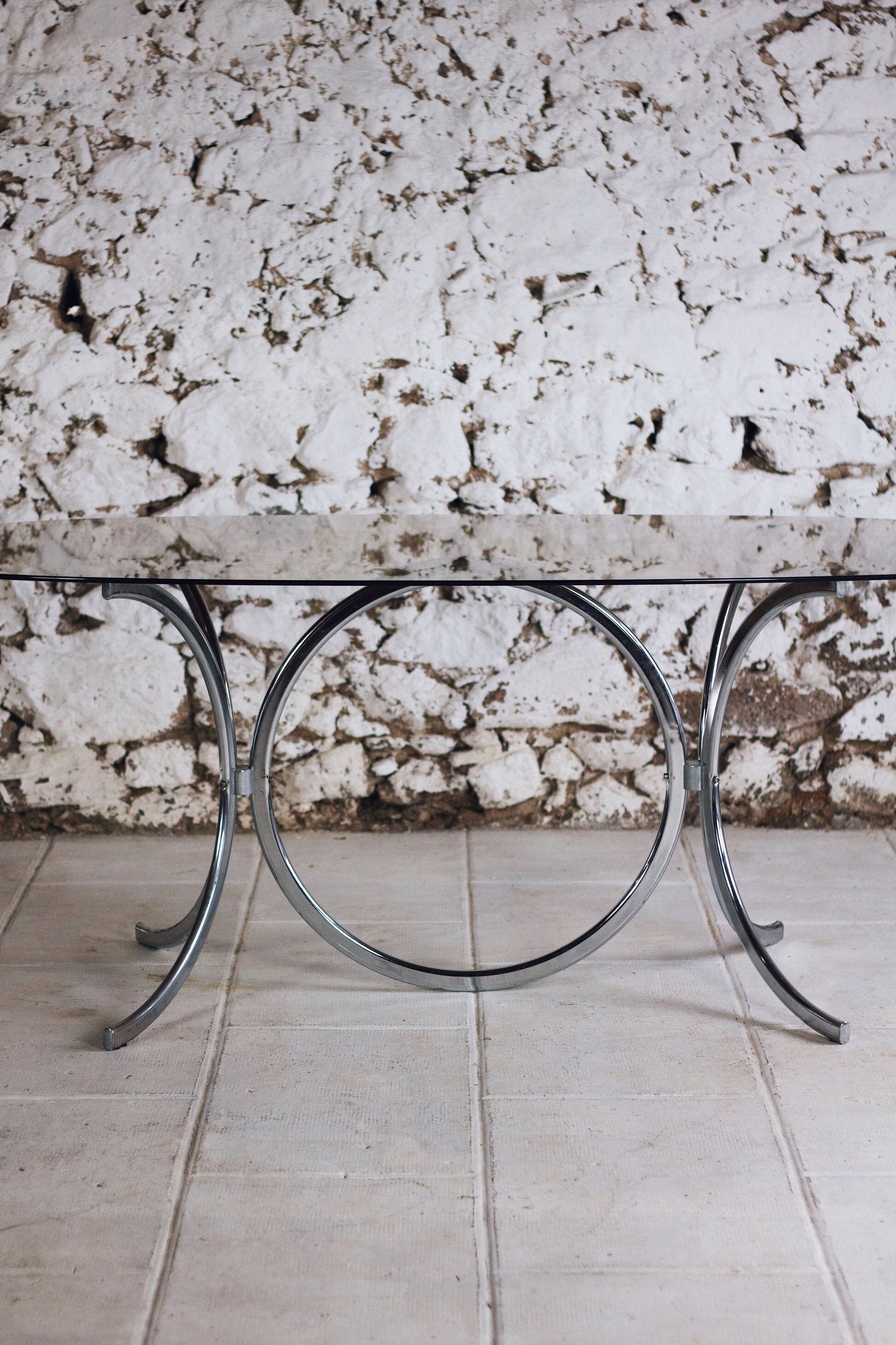 Chrome and smoked glass dining table in the style of Gastone Rinaldi, 1970.