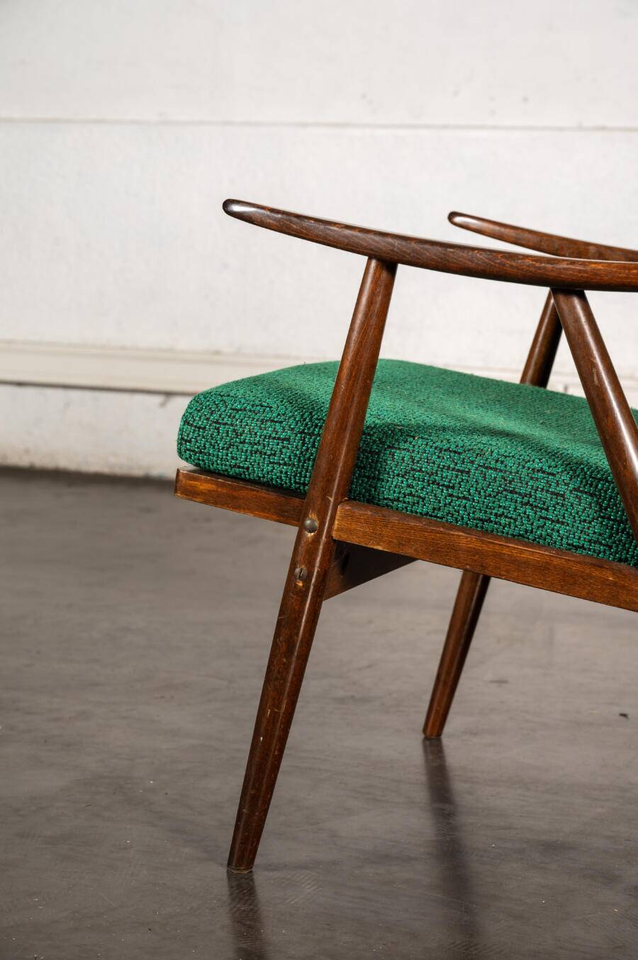 Boomerang chair in green fabric
