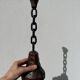 Brutalist wood and metal chain candle holder