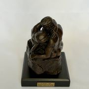 The bronze sculpture The Kiss, a reproduction of Rodin's statue, French sculpture.
