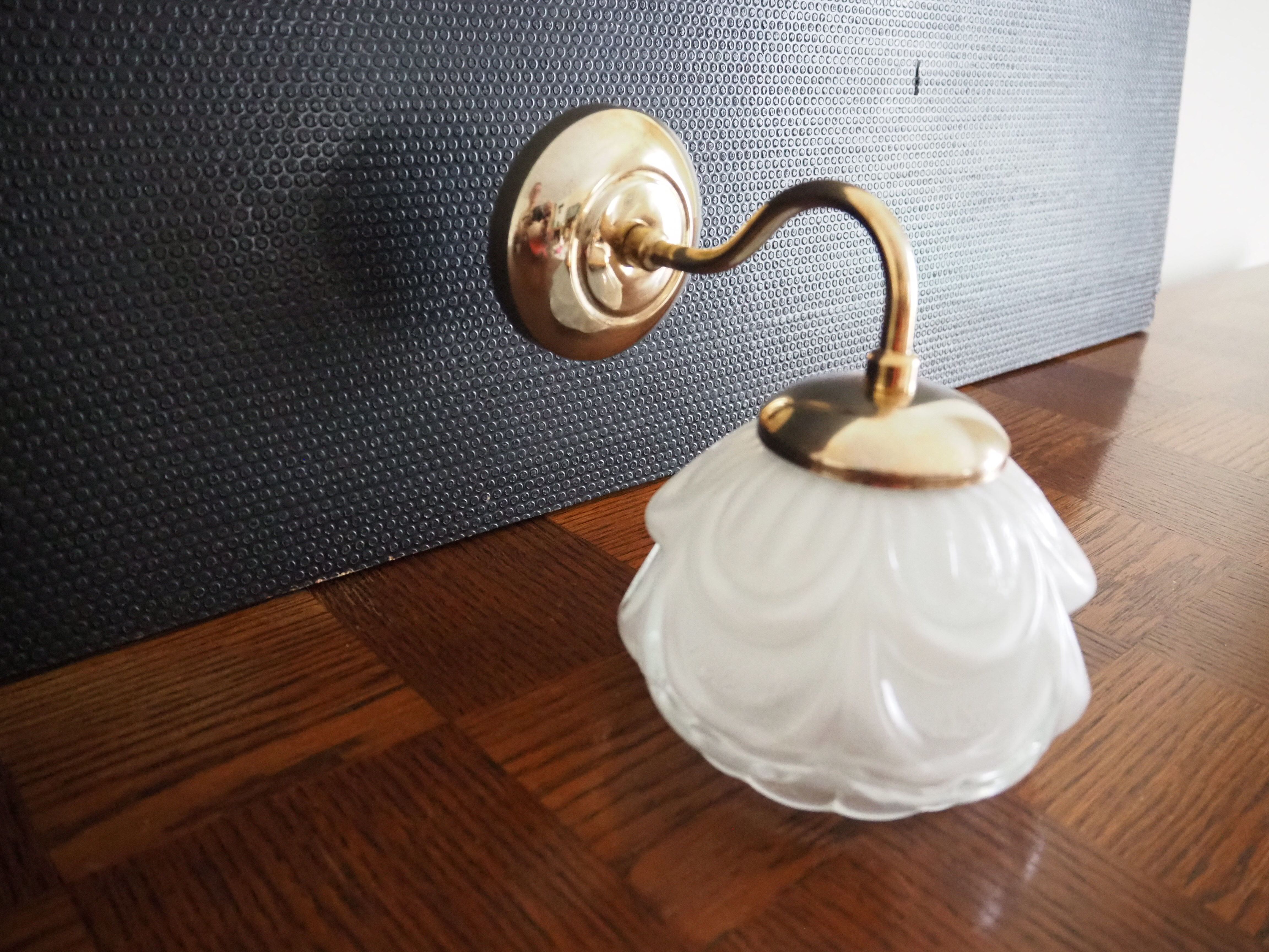 Brass wall lamp and white glass globe from the 1950s-1960s.
