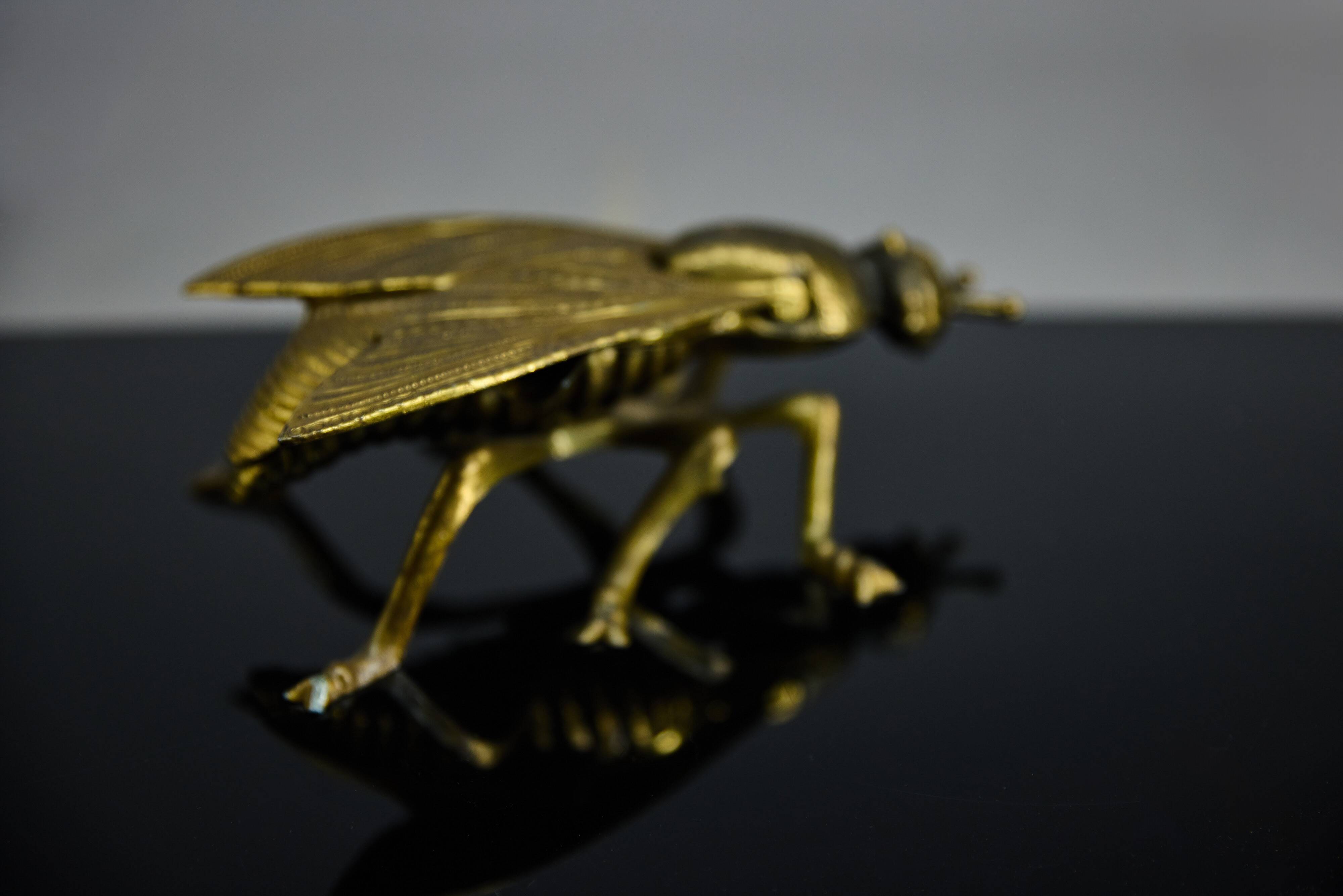 Sculptural ashtray in the shape of a giant fly in brass, Italy, circa 1950.