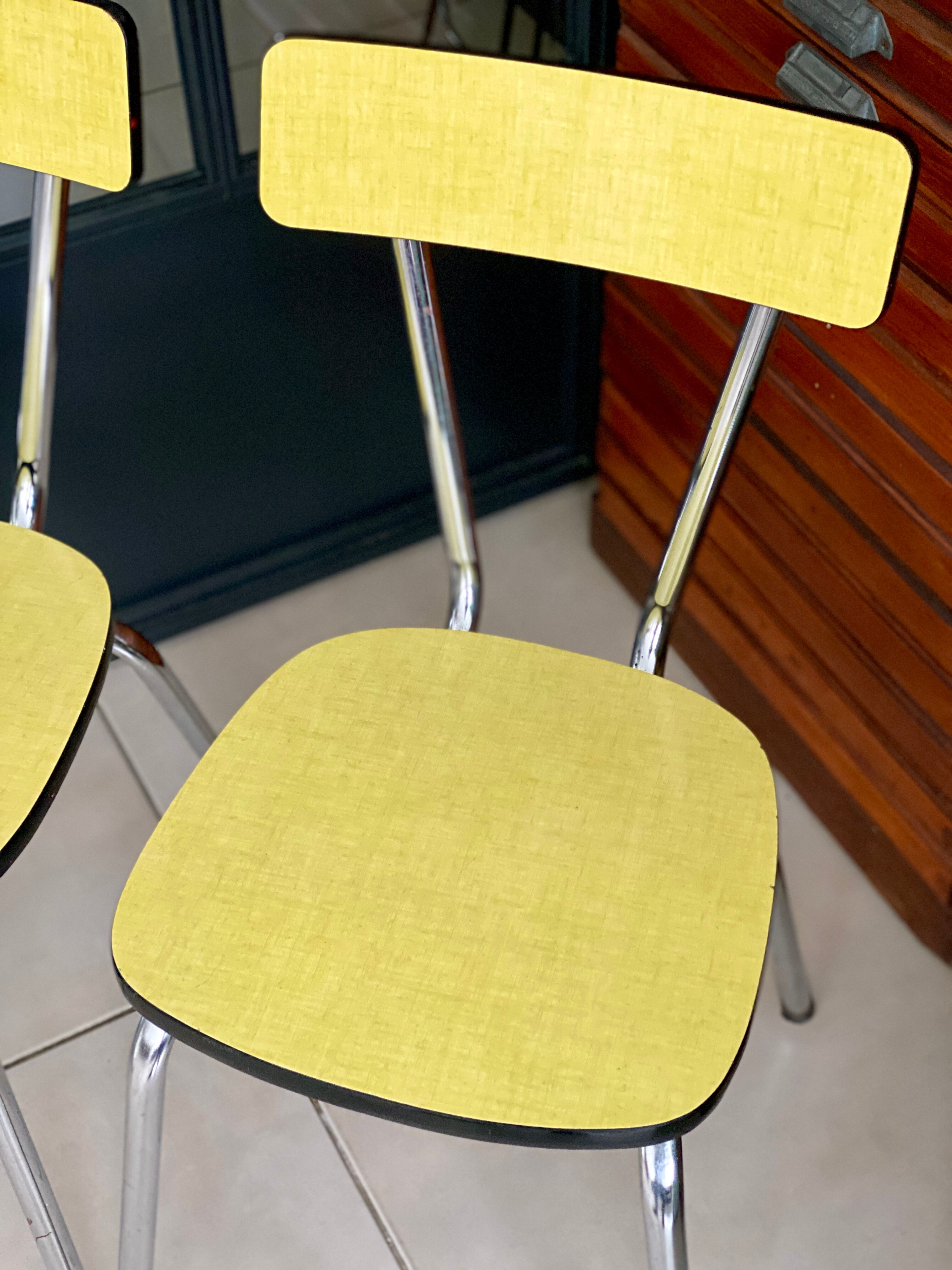 Pair of yellow formica chairs
