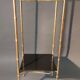 Pedestal table in patinated gilded brass faux foldable bamboo.