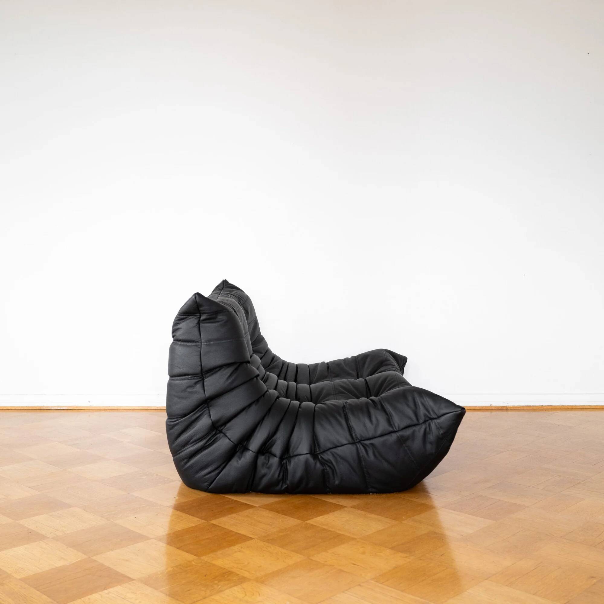 Black leather 2-seater Togo sofa by Michel Ducaroy