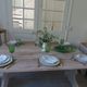 Console, solid walnut table, foldable extensions, grey patinated legs.