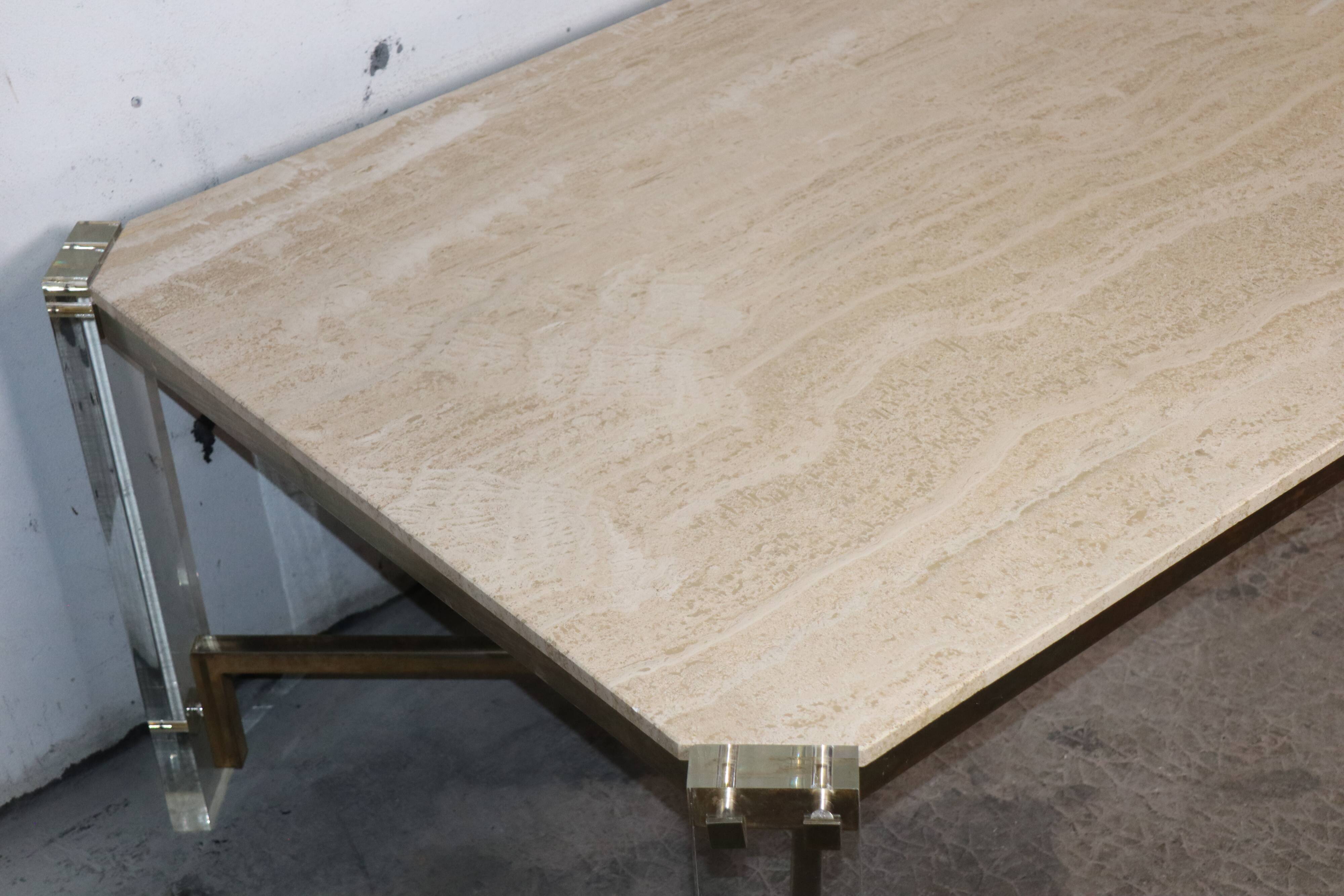 1970s dining table in travertine, gold metal and plexiglass.