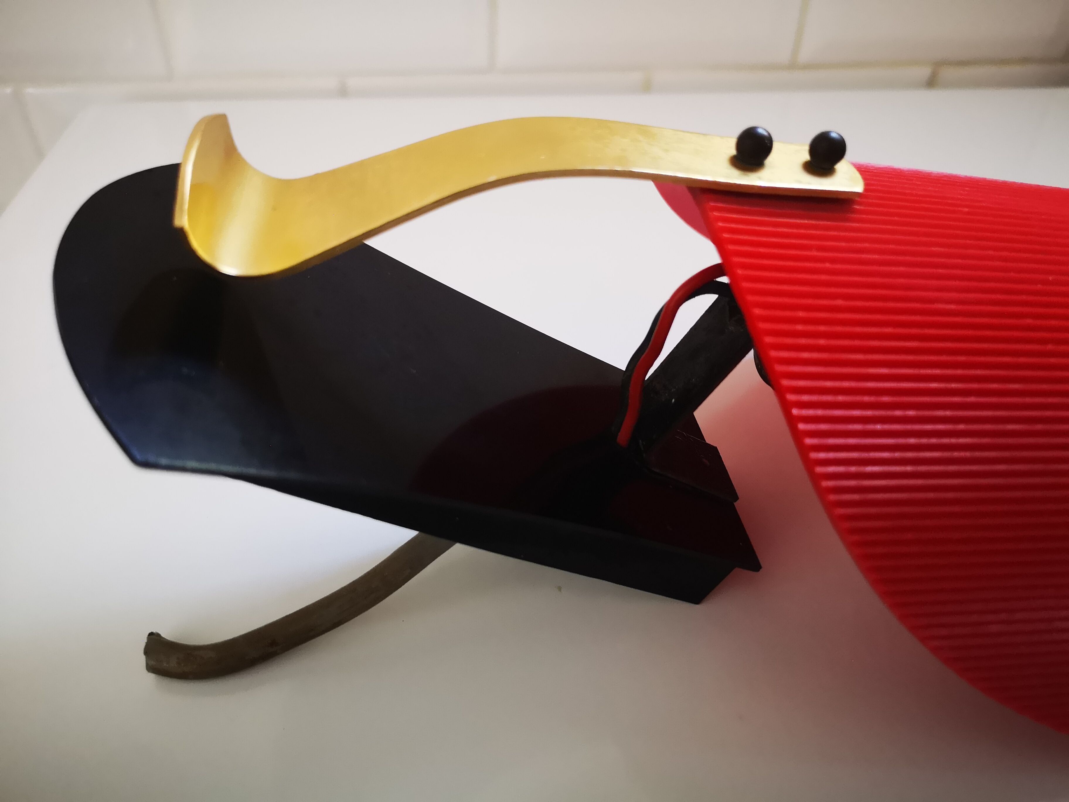 Red and black vintage sconce in fluted plastic and brass