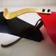 Red and black vintage sconce in fluted plastic and brass