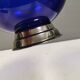 Beautiful blue glass bowl mounted on silver colored base (Original).