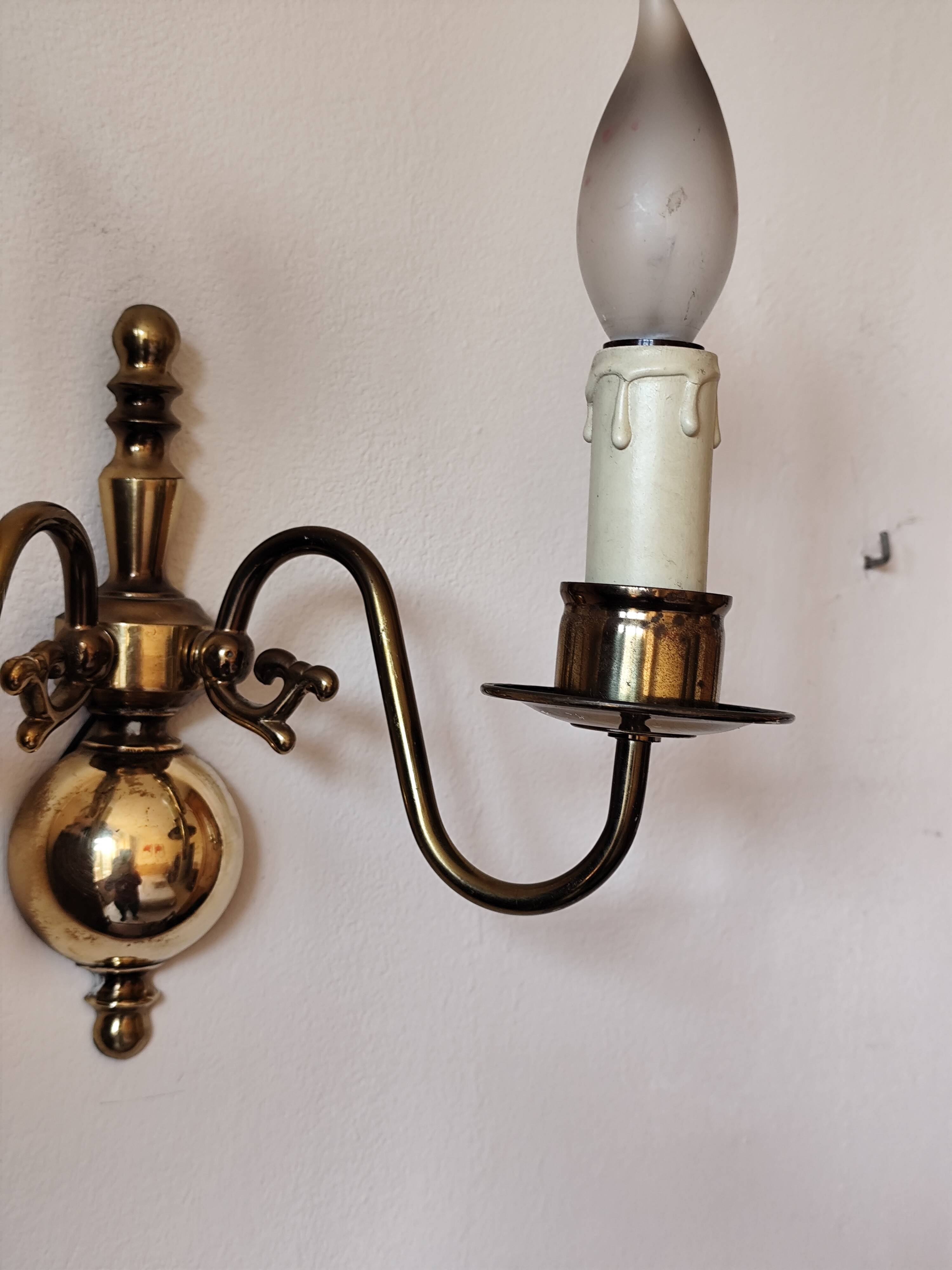 Pair of Dutch style 2-light brass wall lights