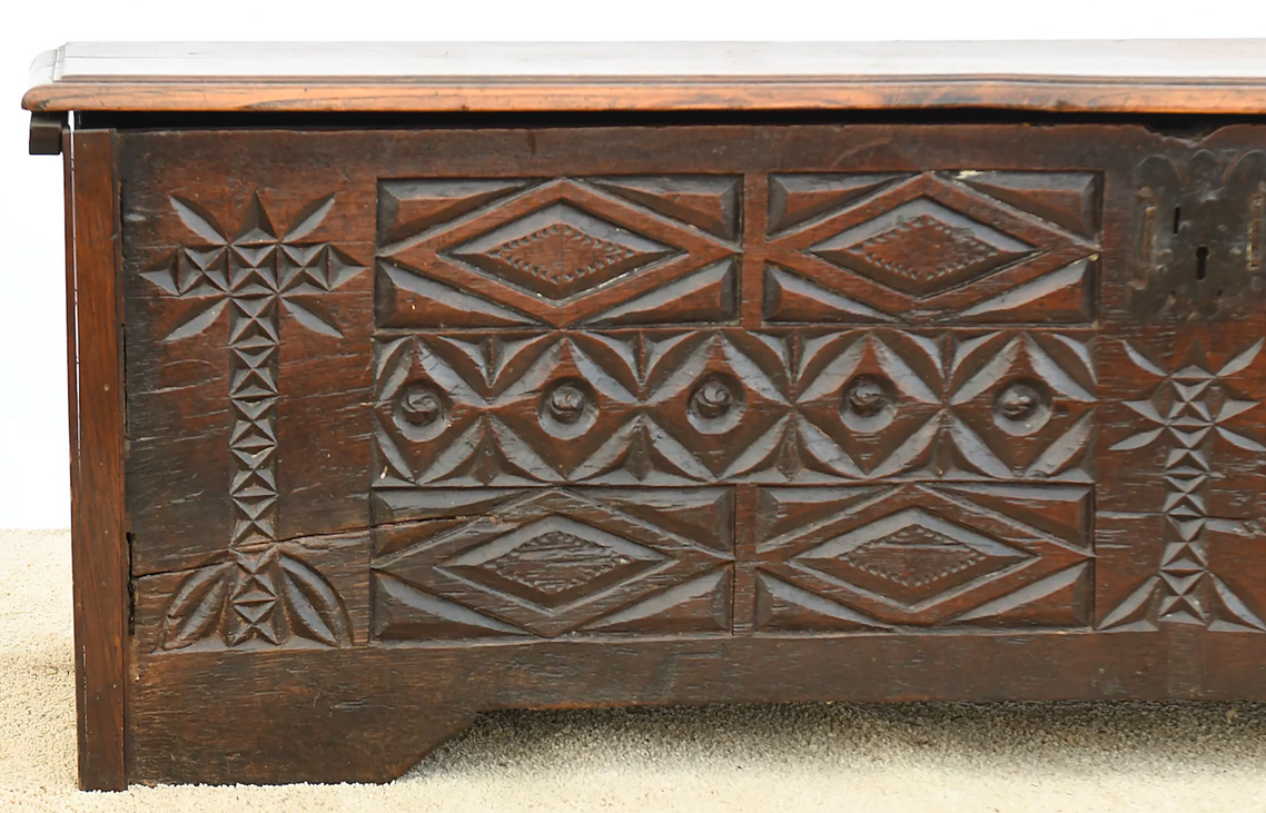 Antique chest in carved wood