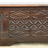 Antique chest in carved wood