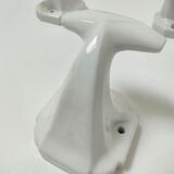 Five art deco white porcelain hooks