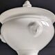 White porcelain confiturier with lion paws and masks. 19th century.