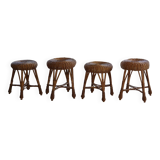 A set of 4 vintage Scandinavian rattan stools, in the style of Tony Paul, from the 1960s.