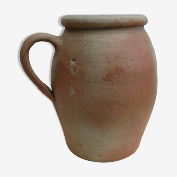Old sandstone pot with a high handle