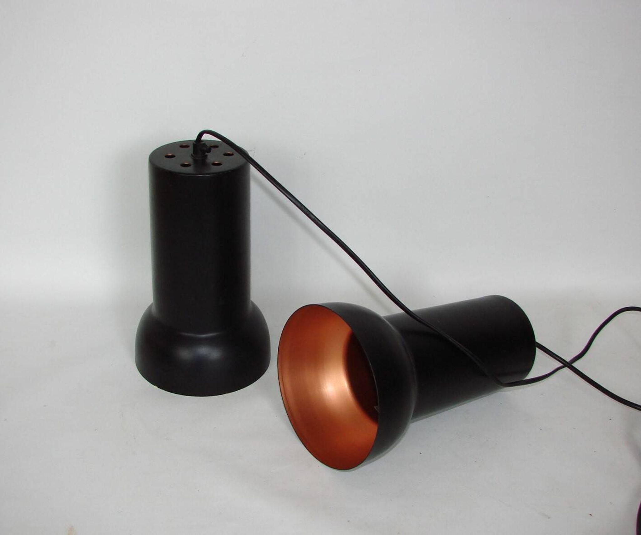 A pair of vintage pendant lights – black brass, modernist