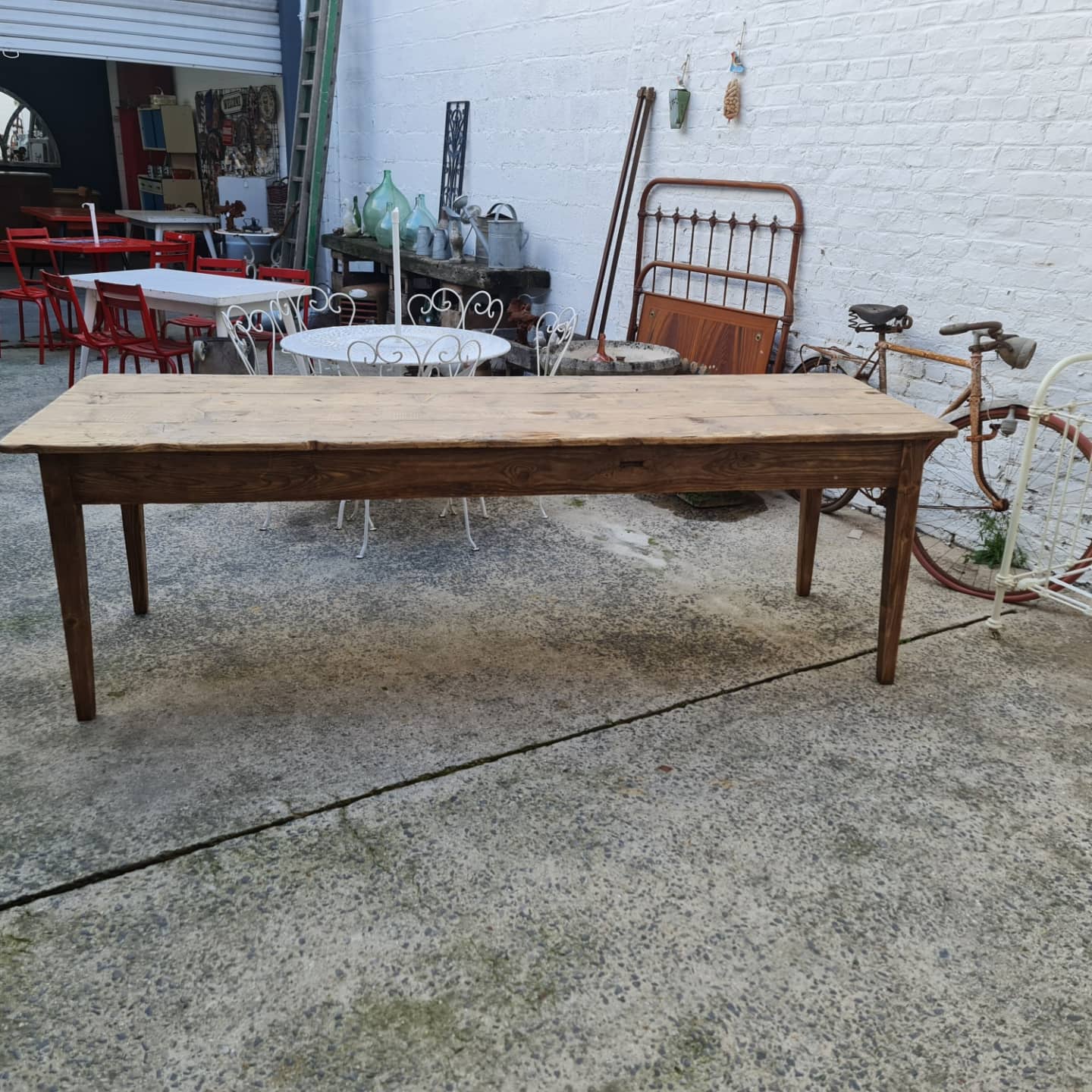 Large antique farmhouse table with a drawer