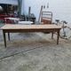 Large antique farmhouse table with a drawer