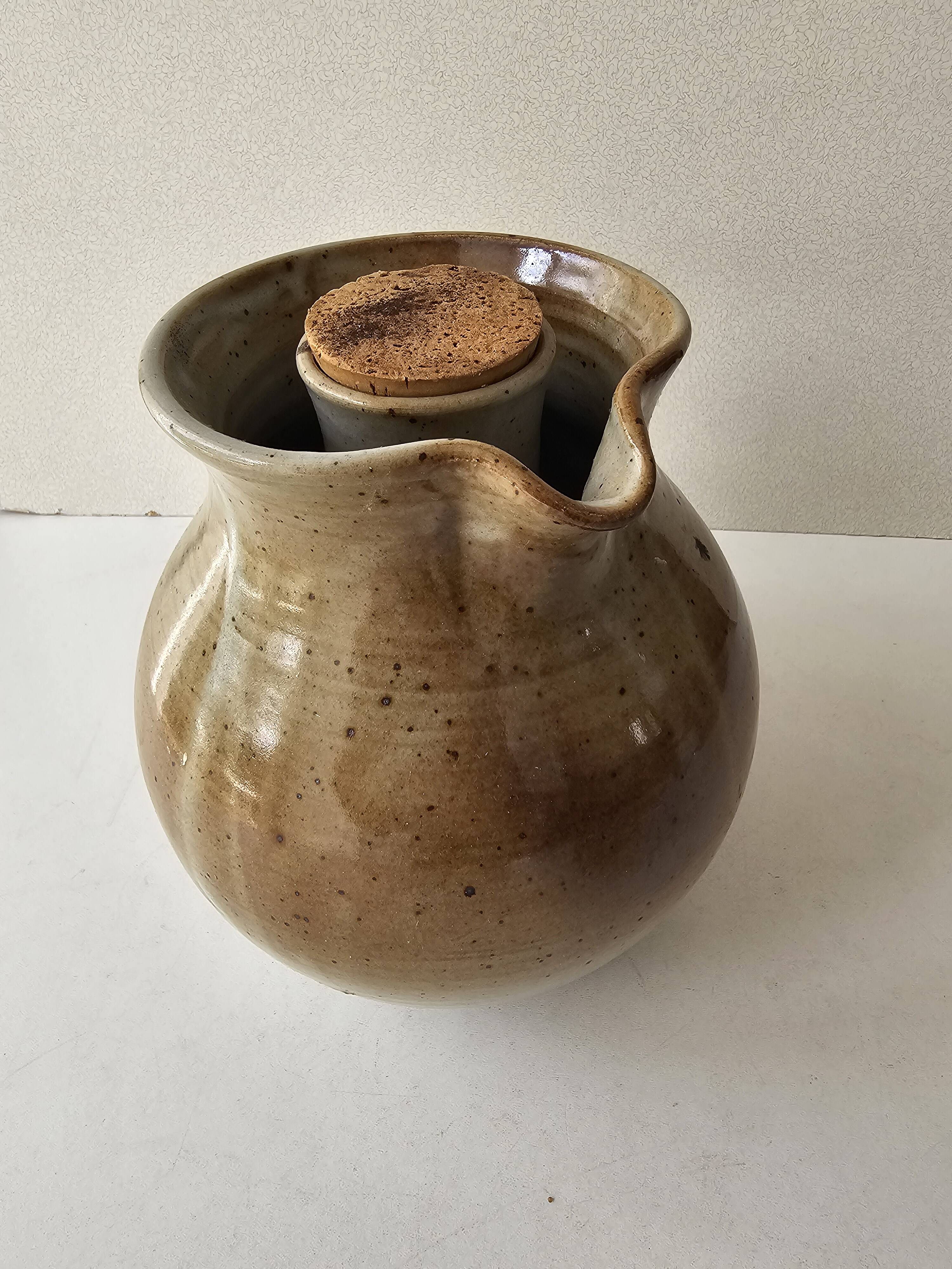 Signed, poured ceramic wine pitcher (signature to be identified)