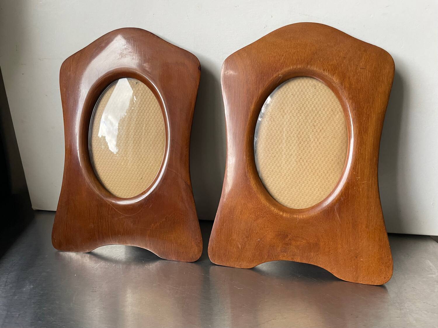 Pair of antique  identical art deco mahogany wooden frames measurements each  25 cm x 17.5 cm  convex glasses