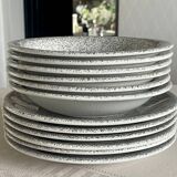 12 speckled ceramic plates.