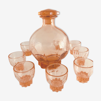 Service with vintage liqueur in pink rosaline glass