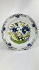 Delftware plate in white and blue with floral decoration, 18th century, Ø 36.5 cm