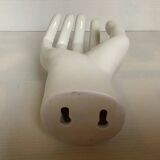 Coat hook representing a hand