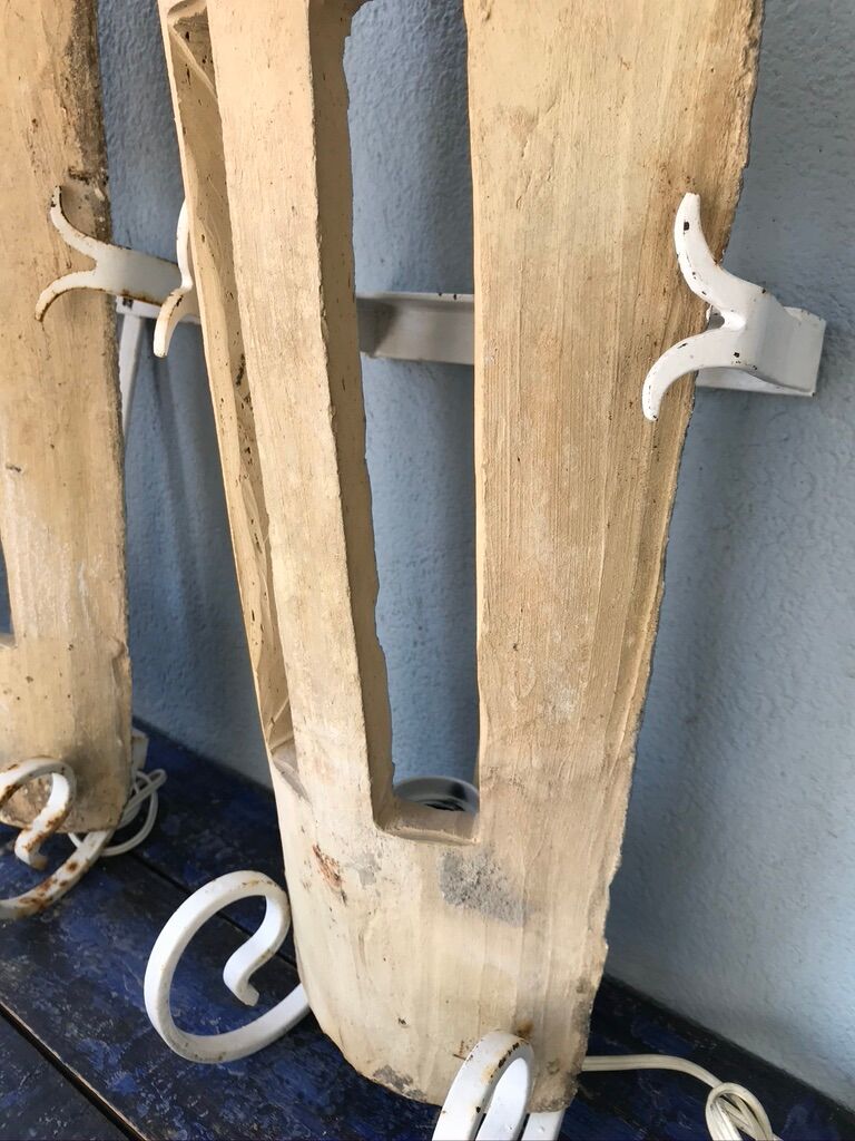 Lot of three terracotta and wrought iron appliques